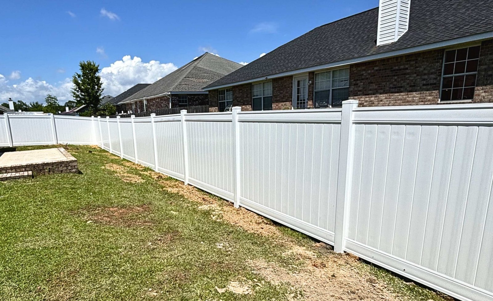 White vinyl privacy fence installation