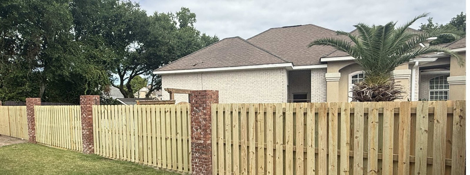 Shadowbox fence with brick pillars in Biloxi Mississippi