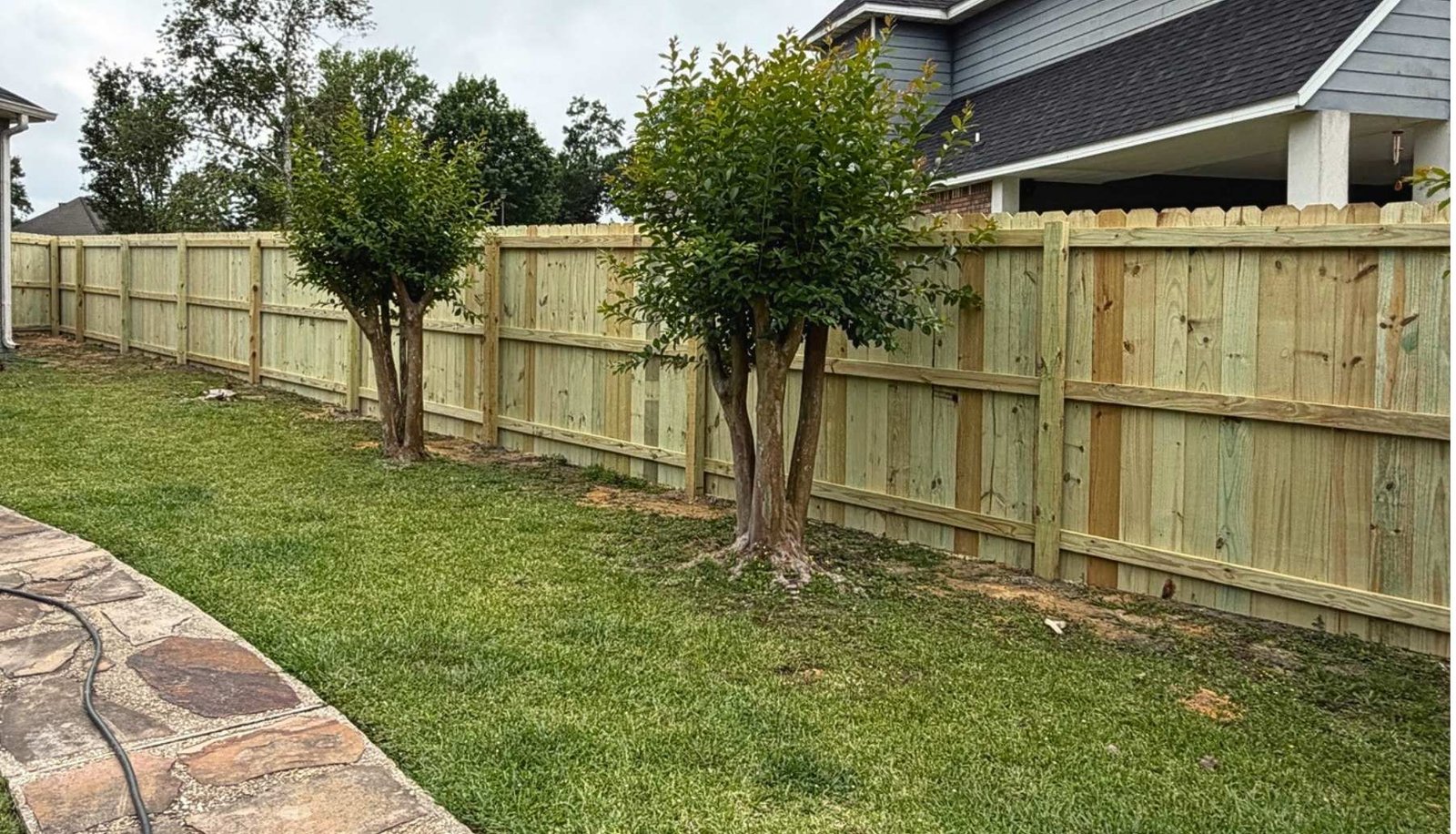 Back side of privacy fence showing clean framing lines in Gulfport